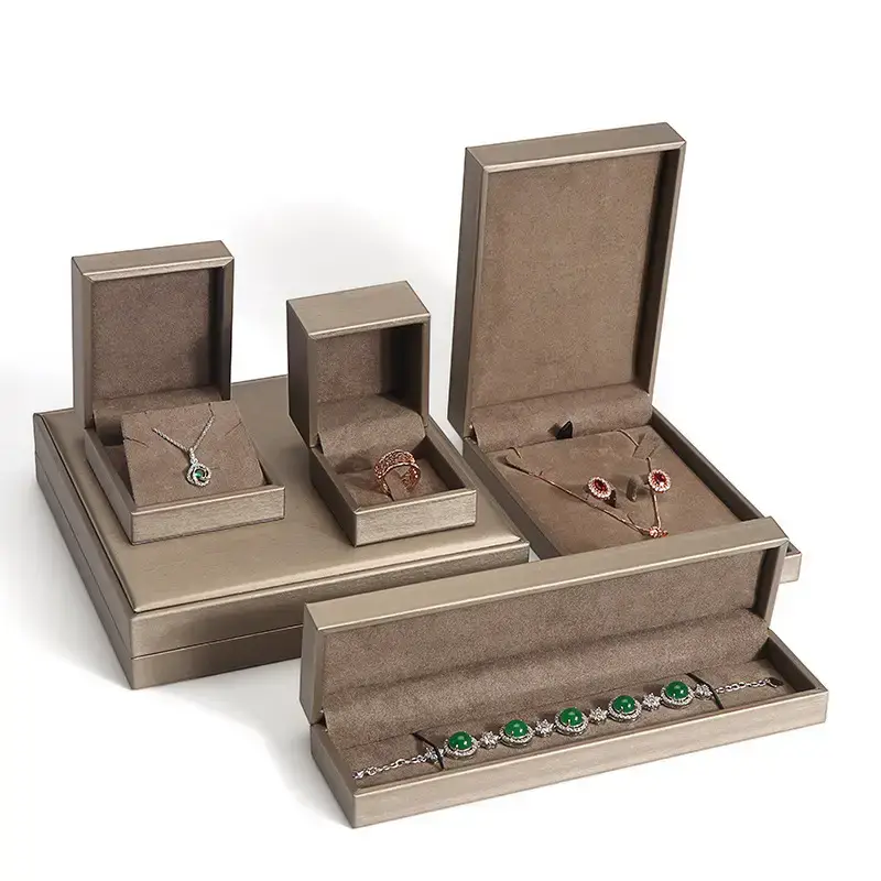 Custom brushed leather jewelry box with debossed logo and velvet interior, available in multiple brand colors