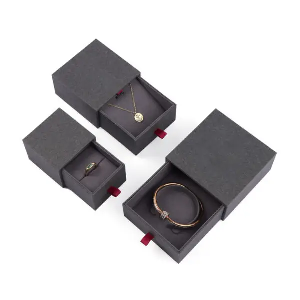 Custom Cardboard Drawer Ring Boxes | Wholesale Jewelry Packaging Custom cardboard drawer ring boxes with embossed logo and velvet interior, wholesale jewelry packaging