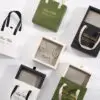 Custom rigid paper earring box with handle, showing branding, foam insert, and premium packaging design for jewelry retailers