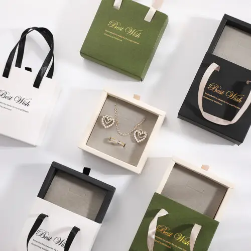 Custom rigid paper earring box with handle, showing branding, foam insert, and premium packaging design for jewelry retailers