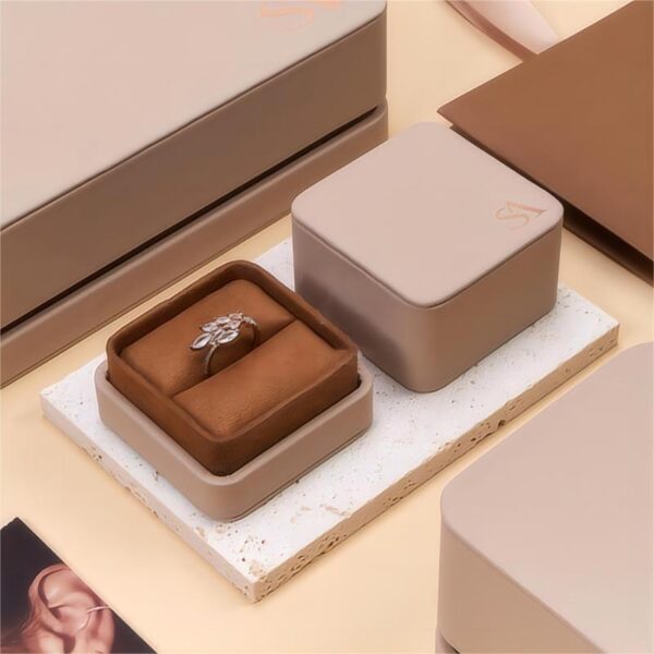 Premium faux leather two-piece jewelry box with customizable color, embossed logo, and luxury velvet interior insert.