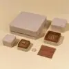 Premium faux leather two-piece jewelry box with customizable color, embossed logo, and luxury velvet interior insert.