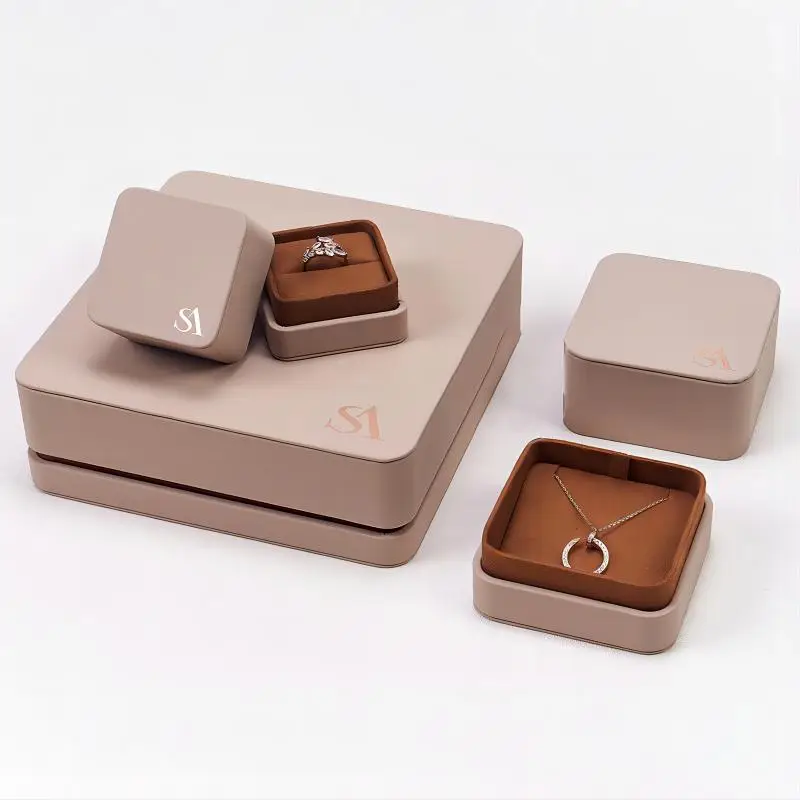 Premium custom leather ring box with embossed logo, magnetic closure, and velvet interior insert