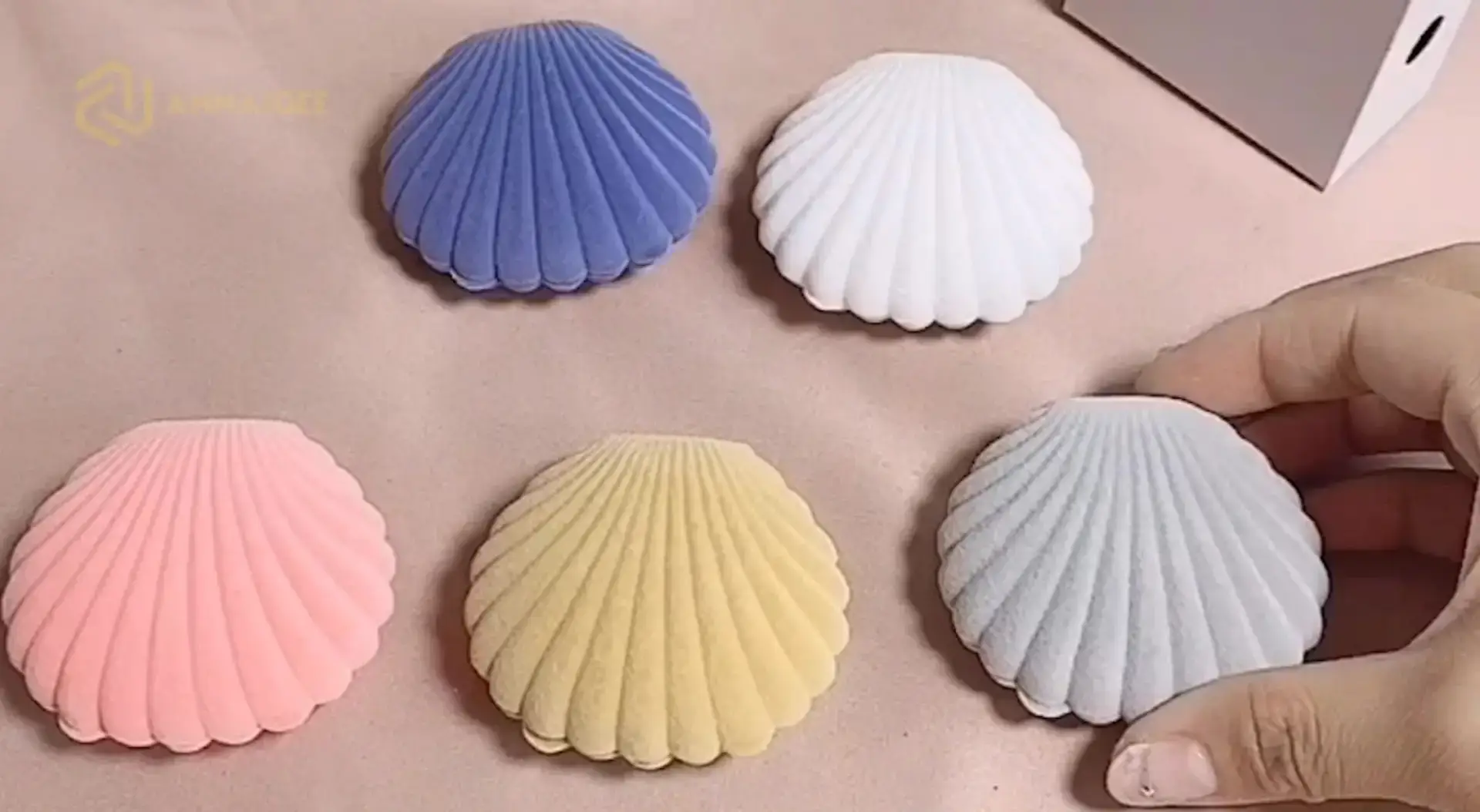 Flocked velvet crown-shaped mini jewelry box with seashell design detail, wholesale custom packaging