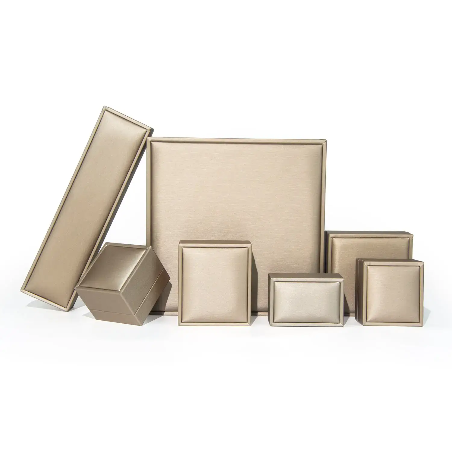 Gold foil custom leather ring box with soft suede interior lining and hinged lid for retail jewelry packaging