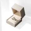 Gold foil custom leather ring box with soft suede interior lining and hinged lid for retail jewelry packaging