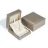 Gold foil custom leather ring box with soft suede interior lining and hinged lid for retail jewelry packaging