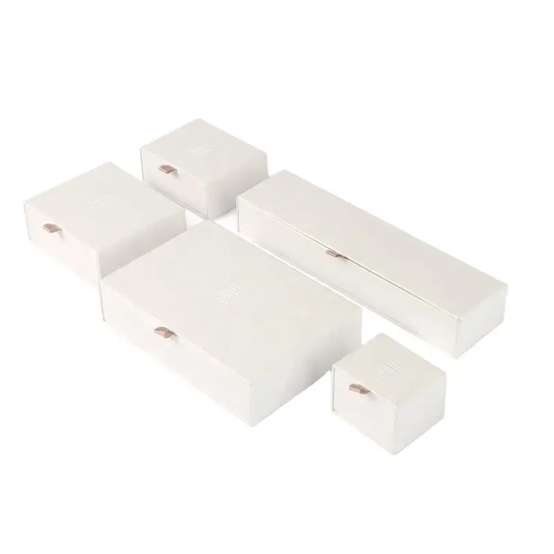 Custom white kraft paper jewelry drawer box with embossed logo and custom EVA foam insert for premium jewelry packaging