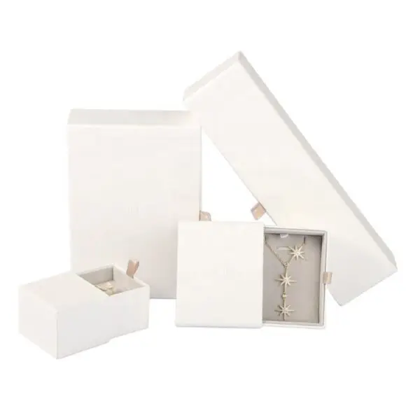 Custom white kraft paper jewelry drawer box with embossed logo and custom EVA foam insert for premium jewelry packaging