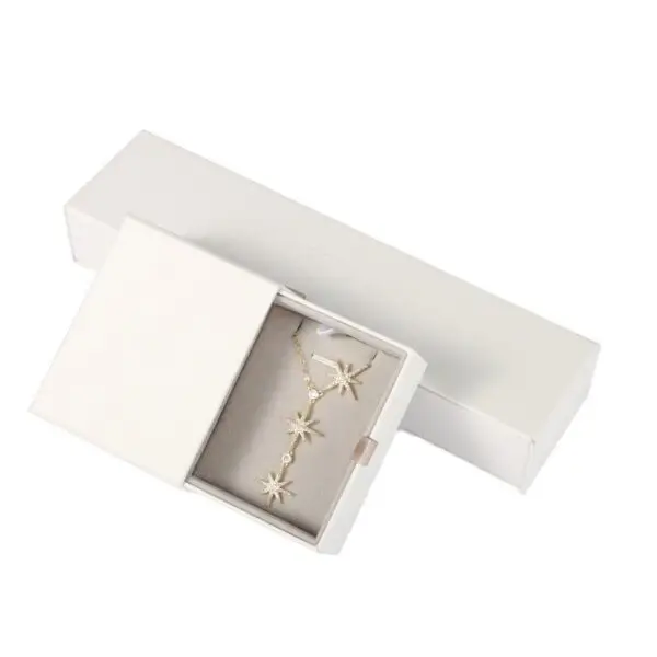 Custom white kraft paper jewelry drawer box with embossed logo and custom EVA foam insert for premium jewelry packaging