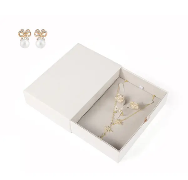 Custom white kraft paper jewelry drawer box with embossed logo and custom EVA foam insert for premium jewelry packaging