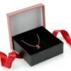 Custom striped bow rigid gift jewelry box with adjustable foam insert, shown with branded lid and interior layout
