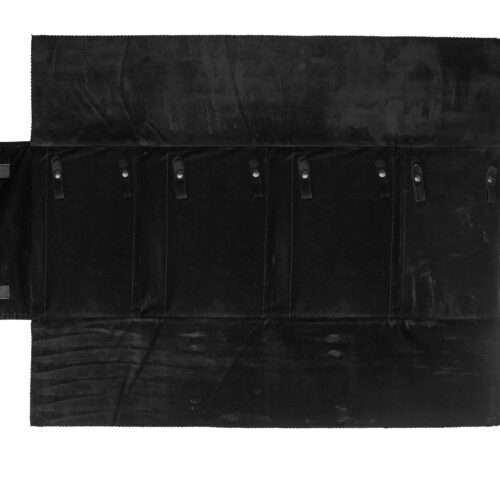 Custom jewelry travel roll with four snap closures for organizing and protecting necklaces during travel and transit.