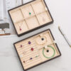 Custom Leather Multi-Layer Jewelry Box Custom multi-layer leather jewelry box with logo branding, velvet compartments, and customizable interior
