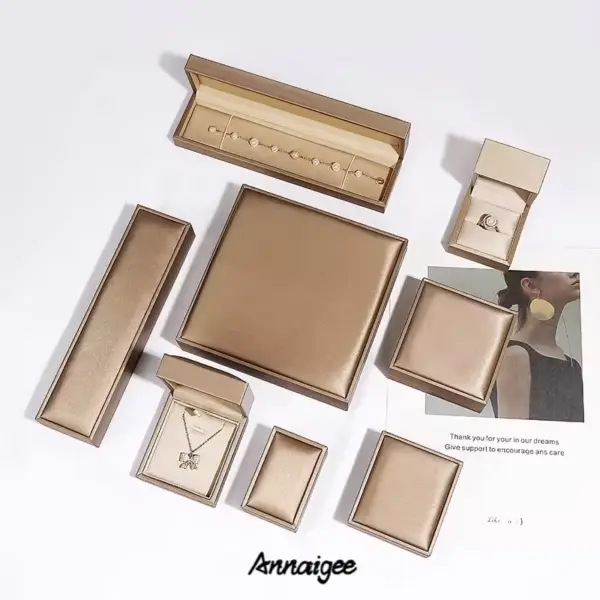 Premium custom leather jewelry boxes with embossed logo branding, luxury packaging for high-end jewelry retailers and e-commerce brands