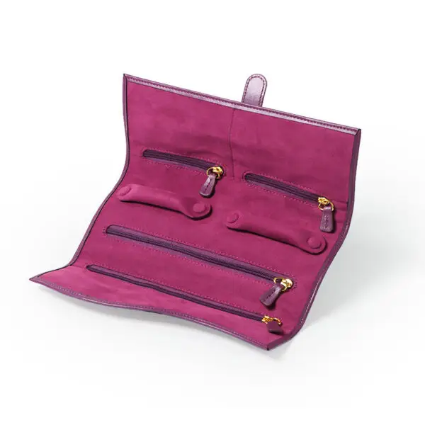 Custom purple leather jewelry roll bag with personalized branding and interior pockets for traveling jewelry organization