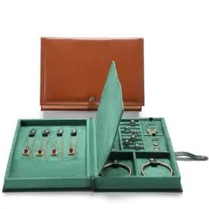 Custom leather book-style jewelry storage box with embossed logo and interior compartments for travel jewelry storage
