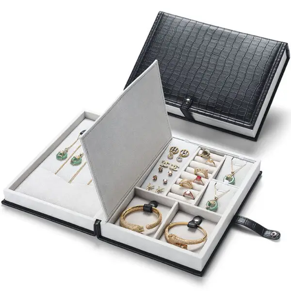Custom Leather Book-Shape Jewelry Storage Boxes Custom leather book-style jewelry storage box with embossed logo and interior compartments for travel jewelry storage
