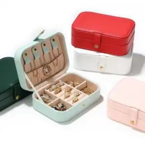 Textured leather travel jewelry case with custom branding, foam inserts, and professional hardware closure