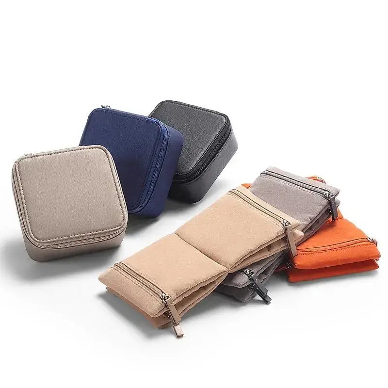 Custom leather travel jewelry case with velvet-lined interior pockets shown in three coordinated sizes, exterior embossed with brand logo