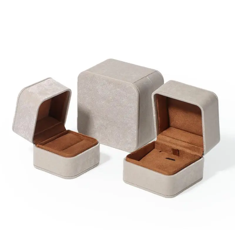Custom gray leatherette flip-top jewelry box with hinged lid, velvet lining and foam insert for jewelry brand packaging
