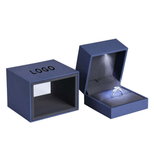 Custom LED Light Jewelry Box | Wholesale OEM Rigid Packaging Custom LED light jewelry box open to show illuminated velvet interior and gold hot-stamp logo branding