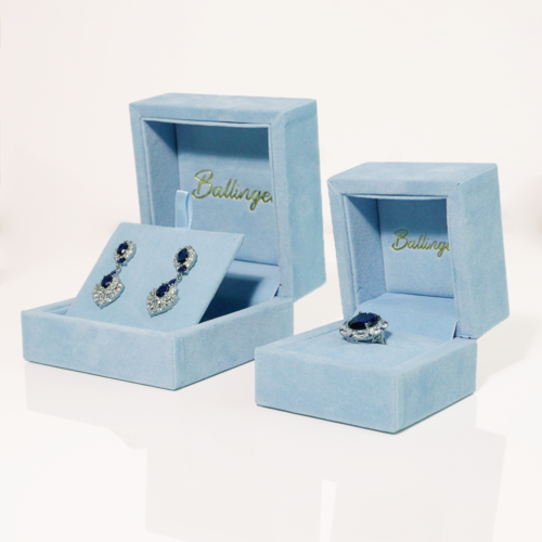 Light blue velvet jewelry box with padded interior for rings and earrings
