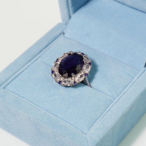 Light blue velvet jewelry box with padded interior for rings and earrings