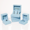 Light blue velvet jewelry box with padded interior for rings and earrings