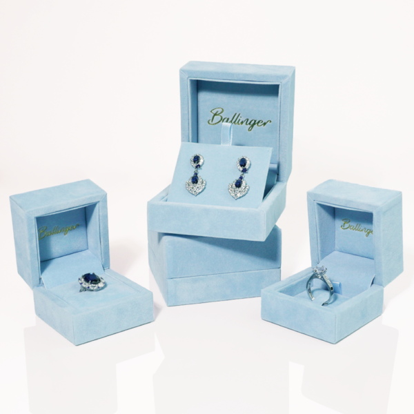 Light blue velvet jewelry box with padded interior for rings and earrings