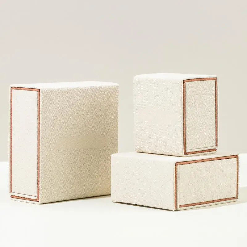 Custom luxury beige linen cotton rigid jewelry boxes with gold foil logo branding — OEM wholesale by On The Way Packaging