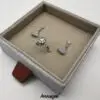 Custom linen fabric sliding drawer earring box with velvet insert and gold hot-foil logo branding for jewelry brands
