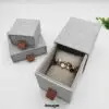 Custom linen fabric sliding drawer earring box with velvet insert and gold hot-foil logo branding for jewelry brands