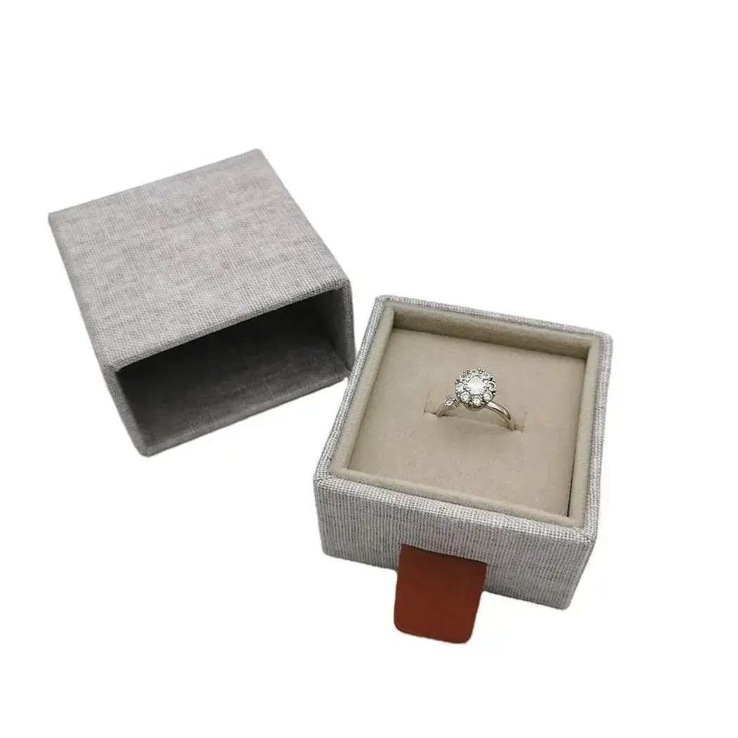 Linen fabric sliding drawer jewelry box with compartmented interior for earrings, rings, bracelets, and necklaces