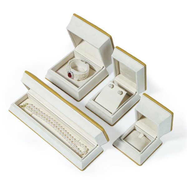 Luxury rigid jewelry box with ornate Middle Eastern-inspired design in deep jewel tones with gold accents, custom branded