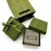Premium custom luxury paper jewelry box with matching fabric pouch, hot-stamped logo, and coordinated branding.