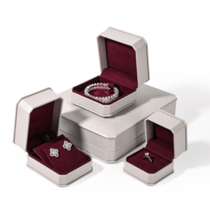 Off-white luxury leather jewelry box set with burgundy suede interior and custom branding options