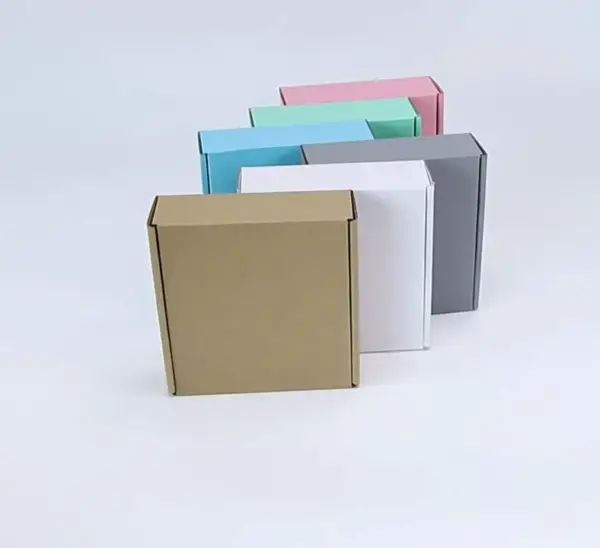 Custom magnetic closure rigid gift box with satin ribbon lift in matte black and gold foil stamped logo for jewelry brand packaging