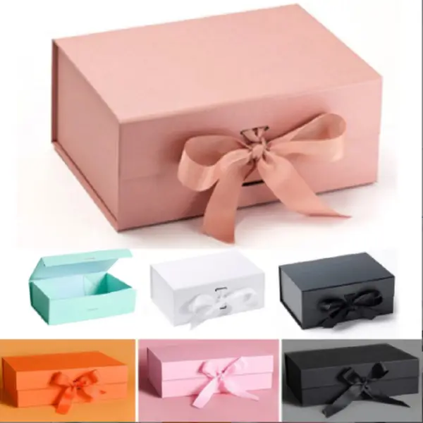 Custom magnetic closure rigid gift box with satin ribbon lift in matte black and gold foil stamped logo for jewelry brand packaging