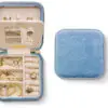 Mini velvet jewelry travel case with zip closure in custom pink and green, designed for jewelry brands