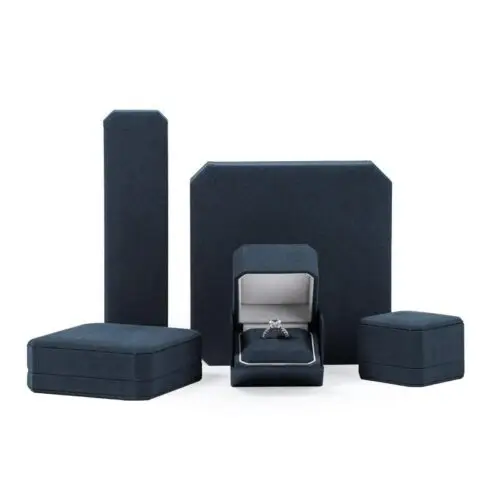 Custom navy blue velvet jewelry box with logo embossing and silk insert, wholesale luxury packaging for jewelry brands