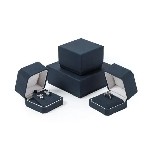Custom navy blue velvet jewelry box with logo embossing and silk insert, wholesale luxury packaging for jewelry brands