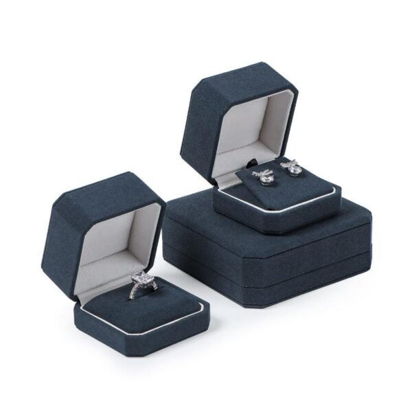 Custom navy blue velvet jewelry box with logo embossing and silk insert, wholesale luxury packaging for jewelry brands