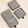 Custom paper drawer jewelry box with matching branded pouch for wholesale jewelry packaging