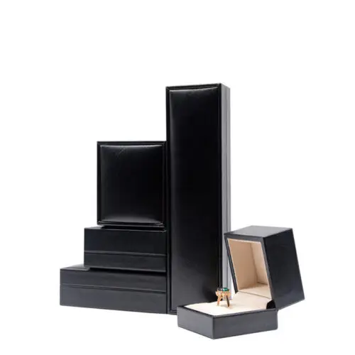 Custom PU leather jewelry box with silk interior and embossed logo branding for luxury wholesale jewelry packaging
