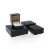 Custom PU leather jewelry box with silk interior and embossed logo branding for luxury wholesale jewelry packaging