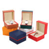 Premium black and red-edged PU wristwatch box with custom logo branding and protective interior padding