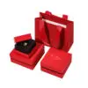 Classic red rigid two-piece jewelry boxes with custom logo branding and foam inserts