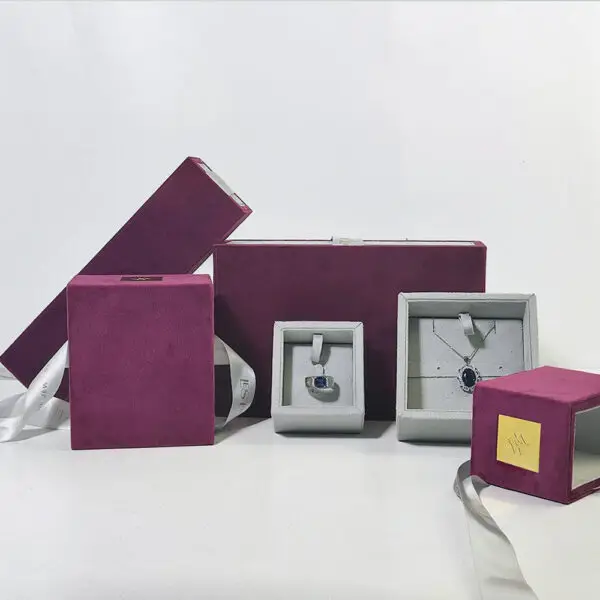 Custom luxury ribbon drawer jewelry box with protective foam insert and branded closure, shown open