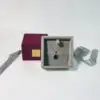 Custom luxury ribbon drawer jewelry box with protective foam insert and branded closure, shown open